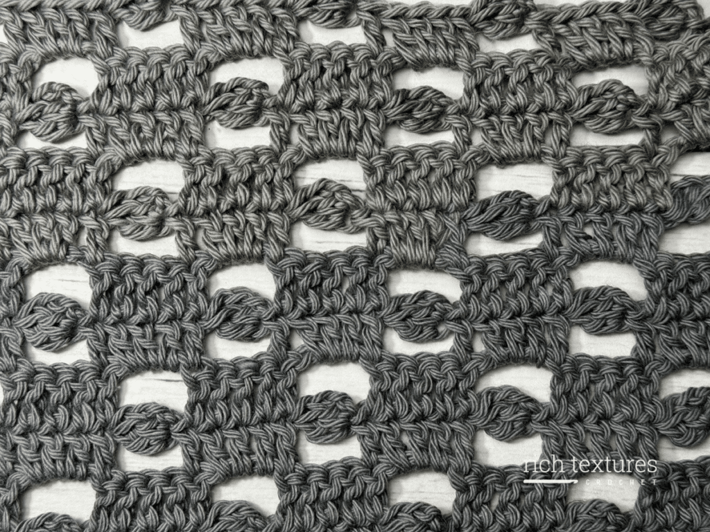 A swatch of the crochet nickel stitch in grey yarn