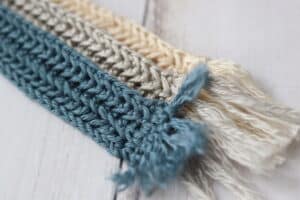 a close up of the fringe on the summer crochet bookmark