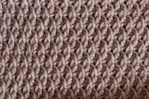 Alpine crochet stitch pattern swatch peach coloured yarn