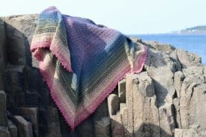 The Brier Island crochet shawl draped over rocks