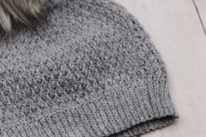 close up of stitching on a grey crochet hat