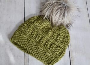 The crochet Field Beanie worked in a green yarn