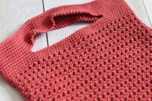 close up of the handles in the Leyburn crochet market bag
