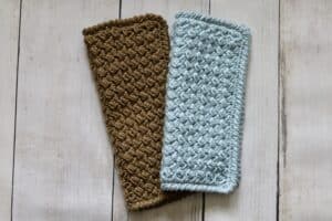 A blue dishcloth and brown textured crochet dishcloth