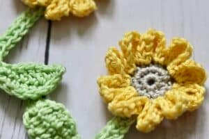 Close up of two crochet sunflowers