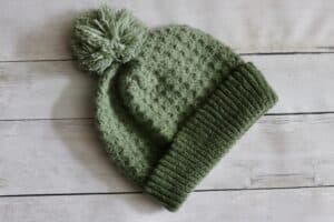 Daydreamer Beanie worked in green yarn
