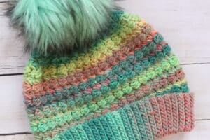 A close up of the stitches and colours in the Crochet Cotton Candy Beanie with a fold up brim