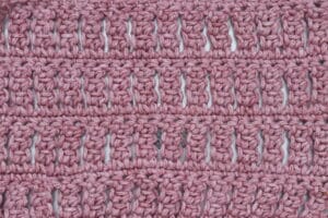 A Swatch of the Double Treble Column Stitch worked in a pink yarn