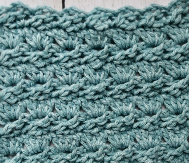 A swatch of the crochet cabbage stitch worked in blue yarn