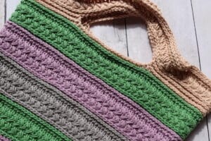 A close up of the handle on the Market Day crochet market bag