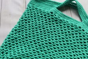A close up of the body on the crochet trellis market bag