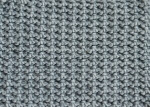 A swatch of the solid crunch stitch worked in a blue yarn.